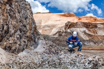 Geologist inspecting samples, Amapa iron ore mine, Brazil, for Anglo American